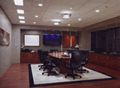 Scene 3: GENERAL MEETING (afternoon) - The lights put the focus on the conference table for an afternoon meeting. The sheer blinds are lowered to reduce direct daylight and solar heat gain while preserving the view in this west-facing conference room.